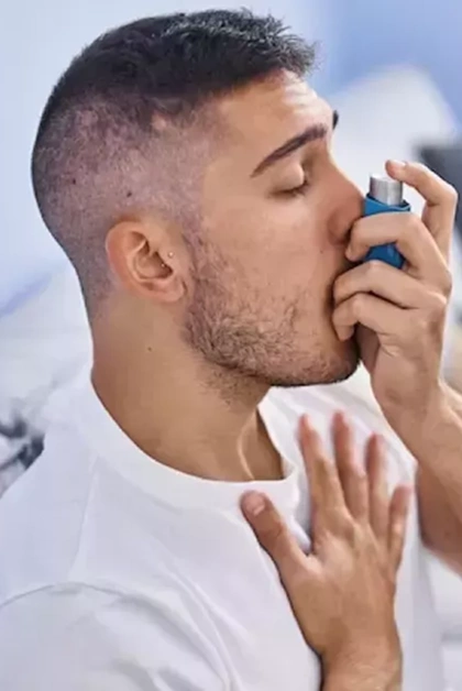 Person using inhaler