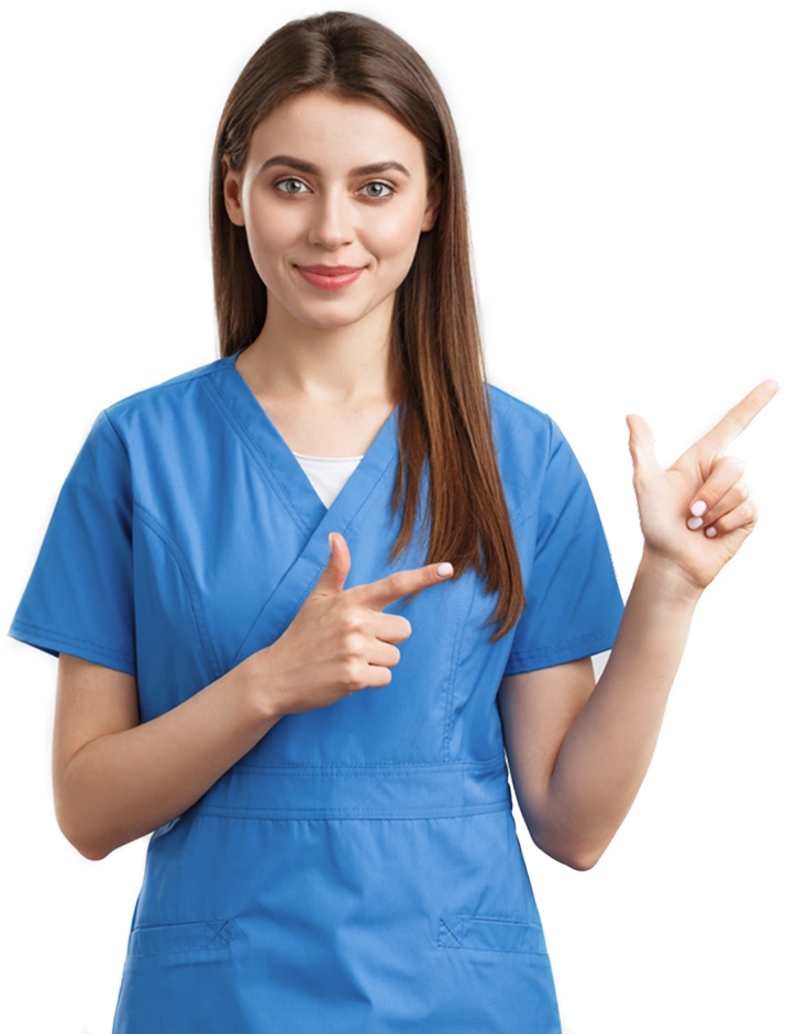 Nurse in blue scrubs smiling and pointing to the side.
