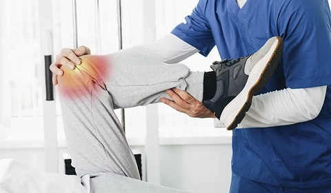 Physiotherapist examining knee pain.